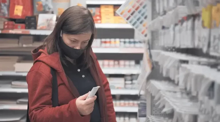 lady browsing in paint aisle